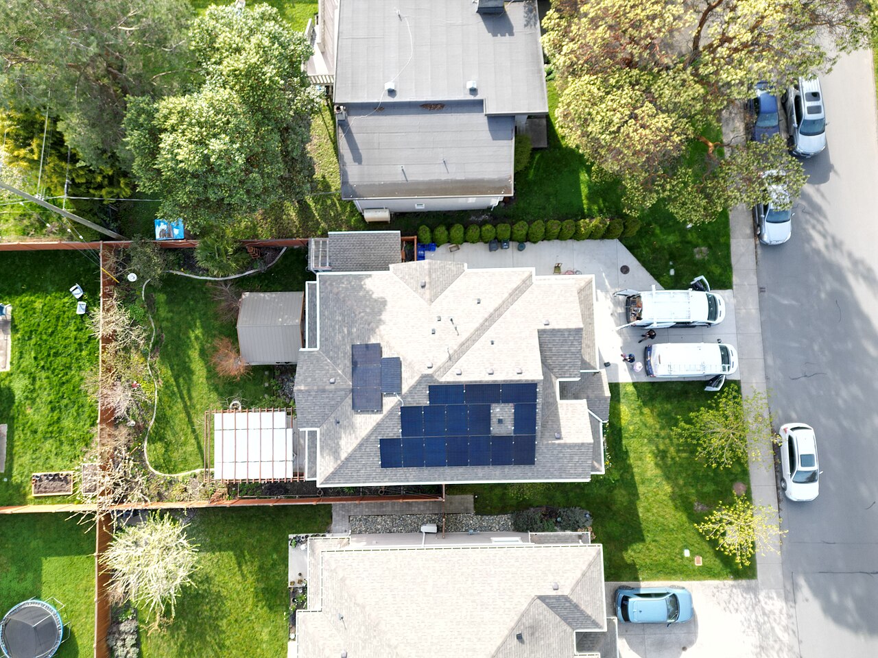 Aerial view of a residential neighbourhood with rooftop solar panels